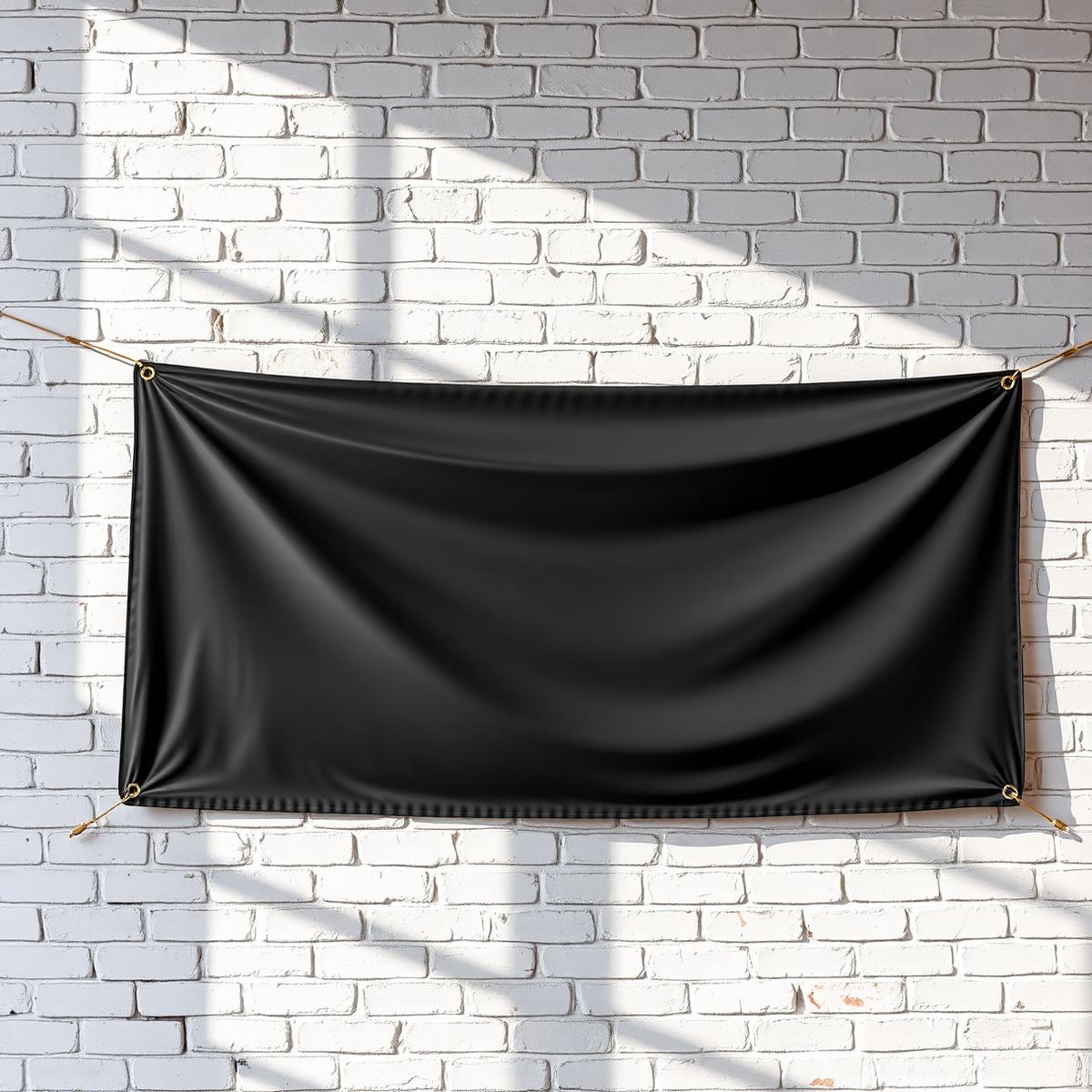 Custom 13oz vinyl banner hanging on a white brick wall with brass grommets